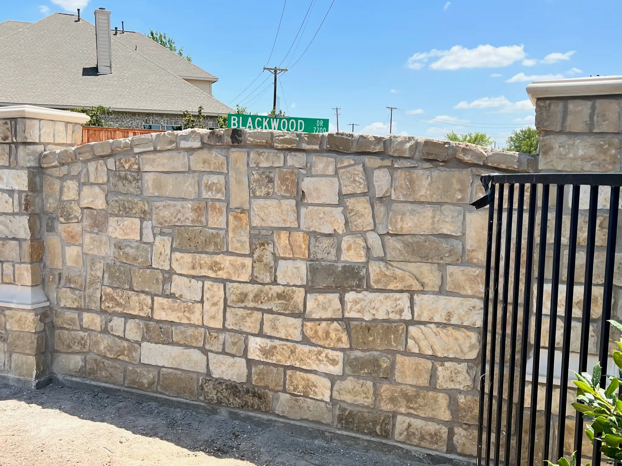 Brick fence with stone columns in Plano